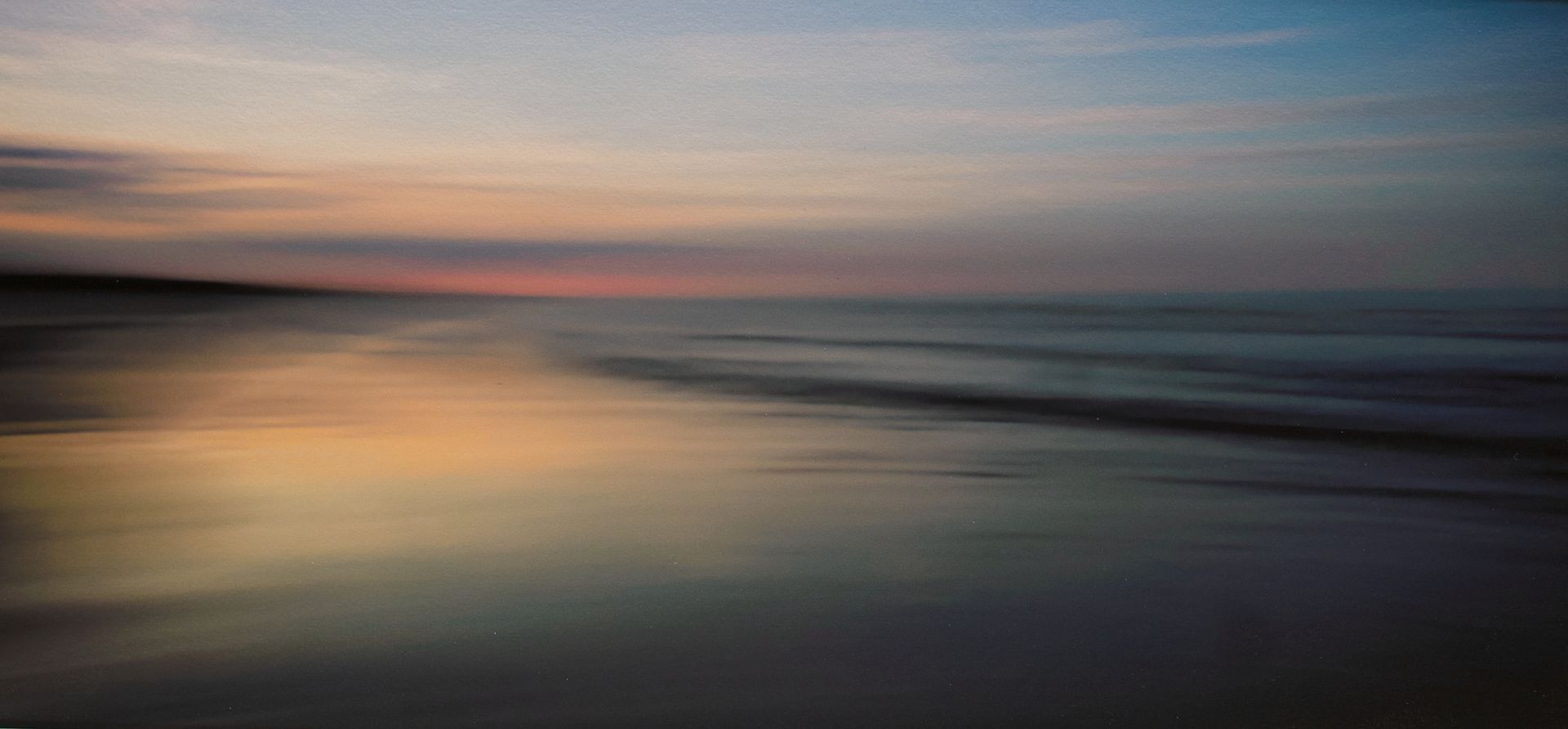 A long exposure image of dawn over the North Sea