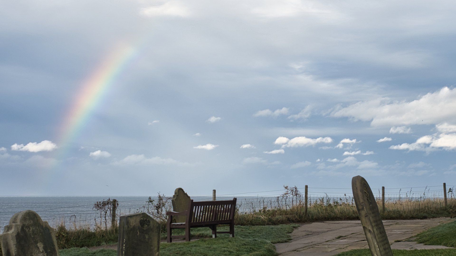 a rainbow in sky over whitby