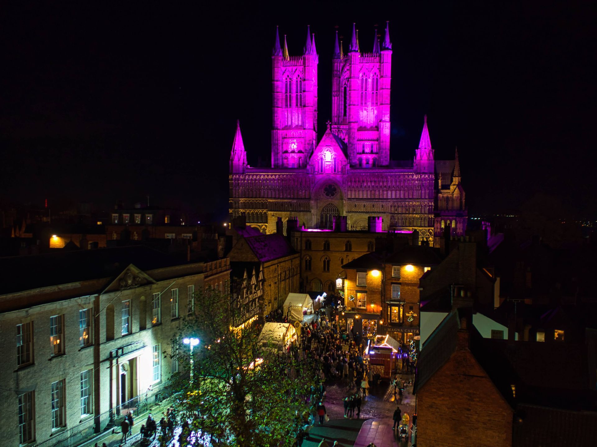 a view of Lincoln at night from the castle walls