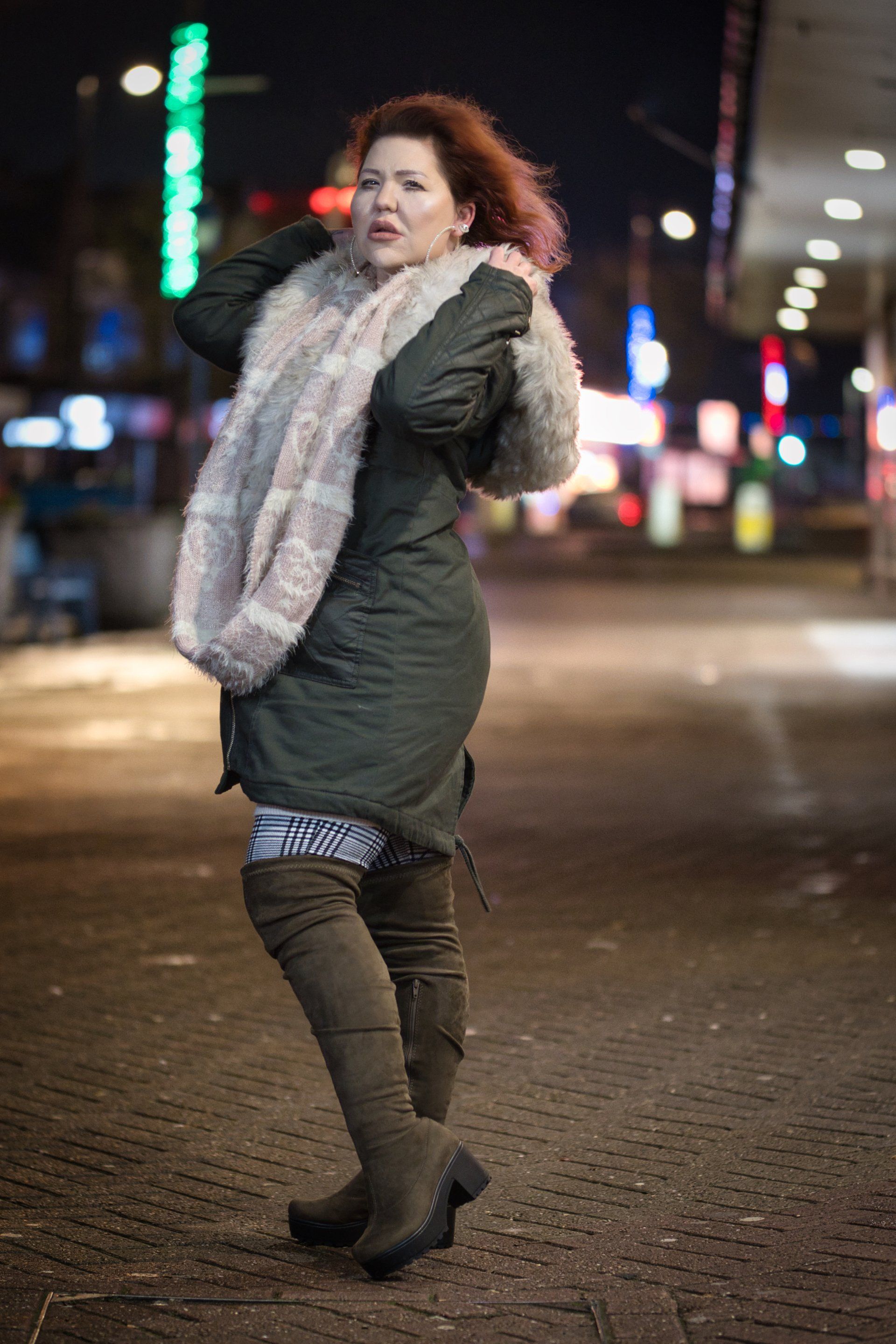 a model pictured on a skegness street at night