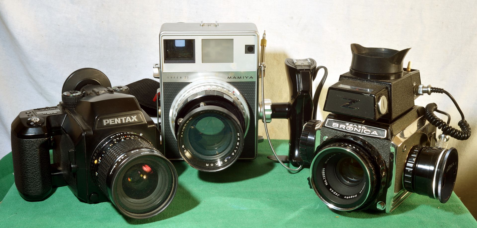 Camera photo by Chris Birchmore a view of three film cameras pentax, mamiya, and bronica