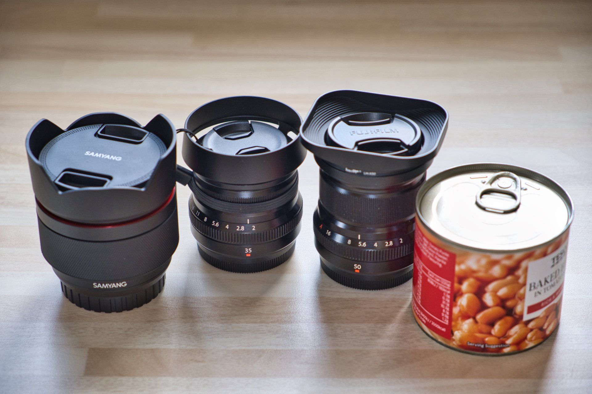 a photo of three prime camera lenses