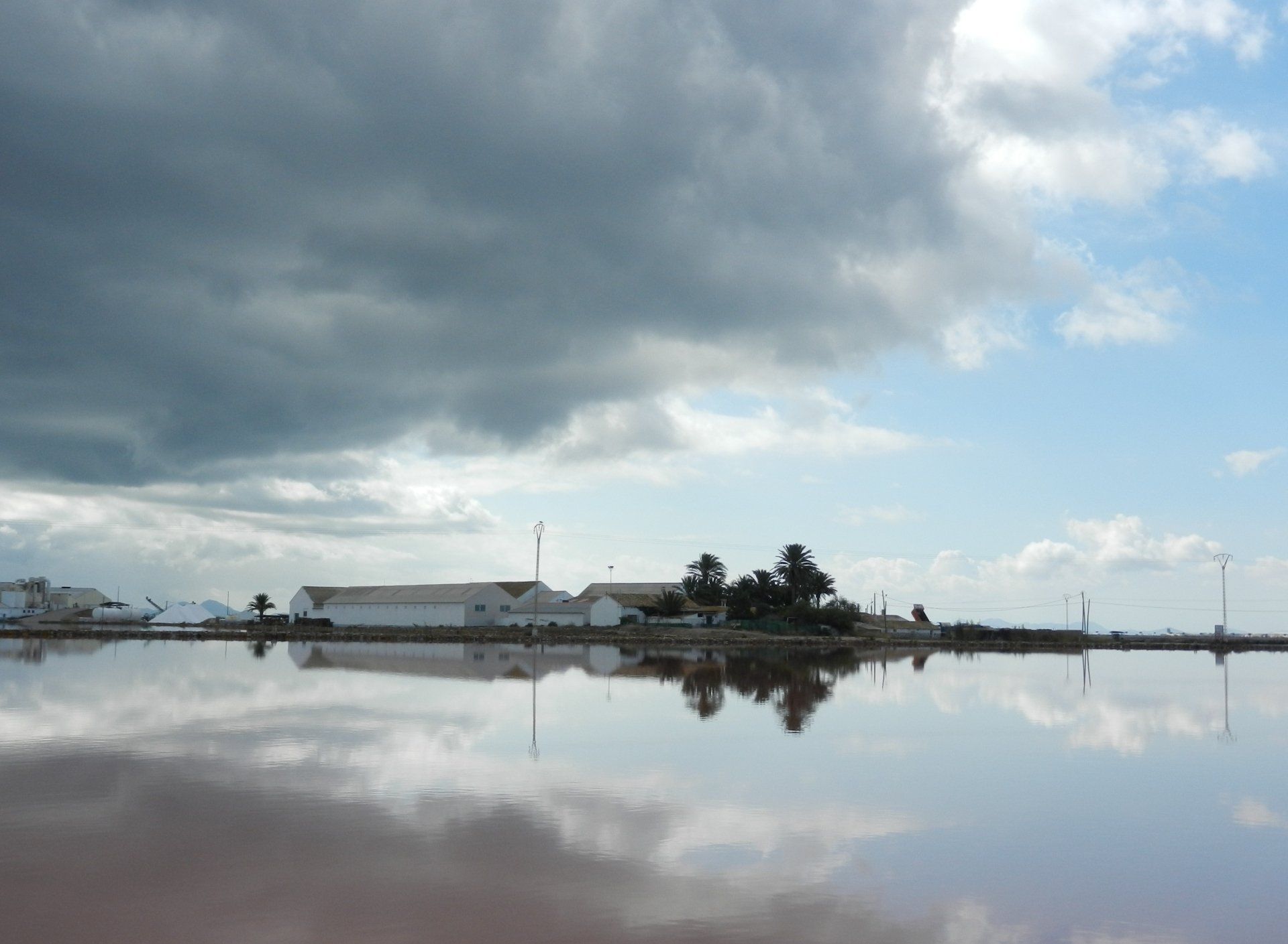 a salt works in southern spain viewed across a saline lagoon