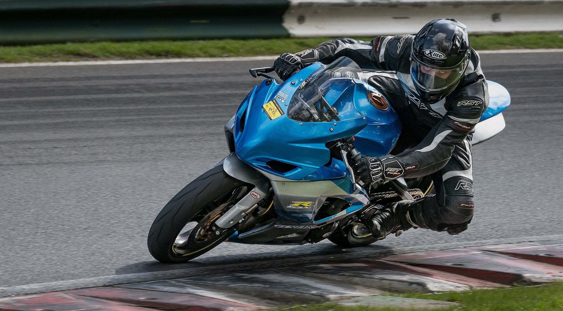 a racing motorcycle rounding a bend at cadwell park