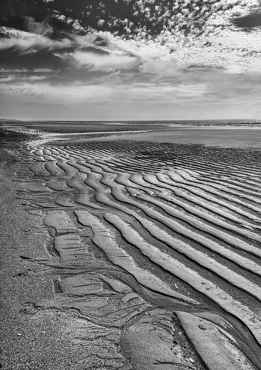 wave patterns in the beach sand