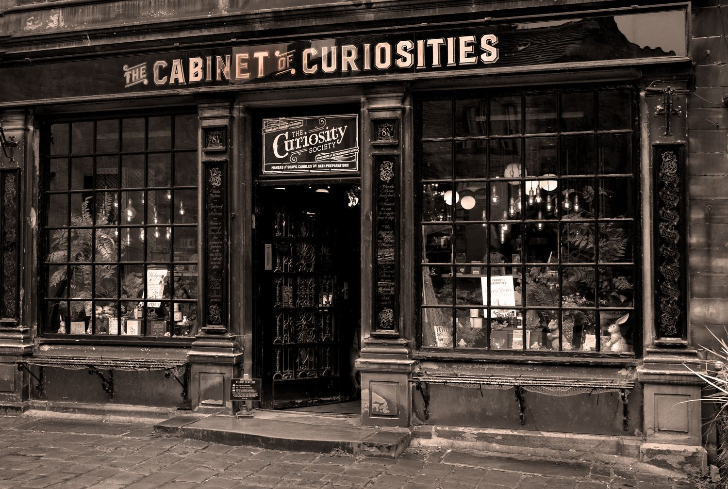 a monochrome view of a shop front in Haworth