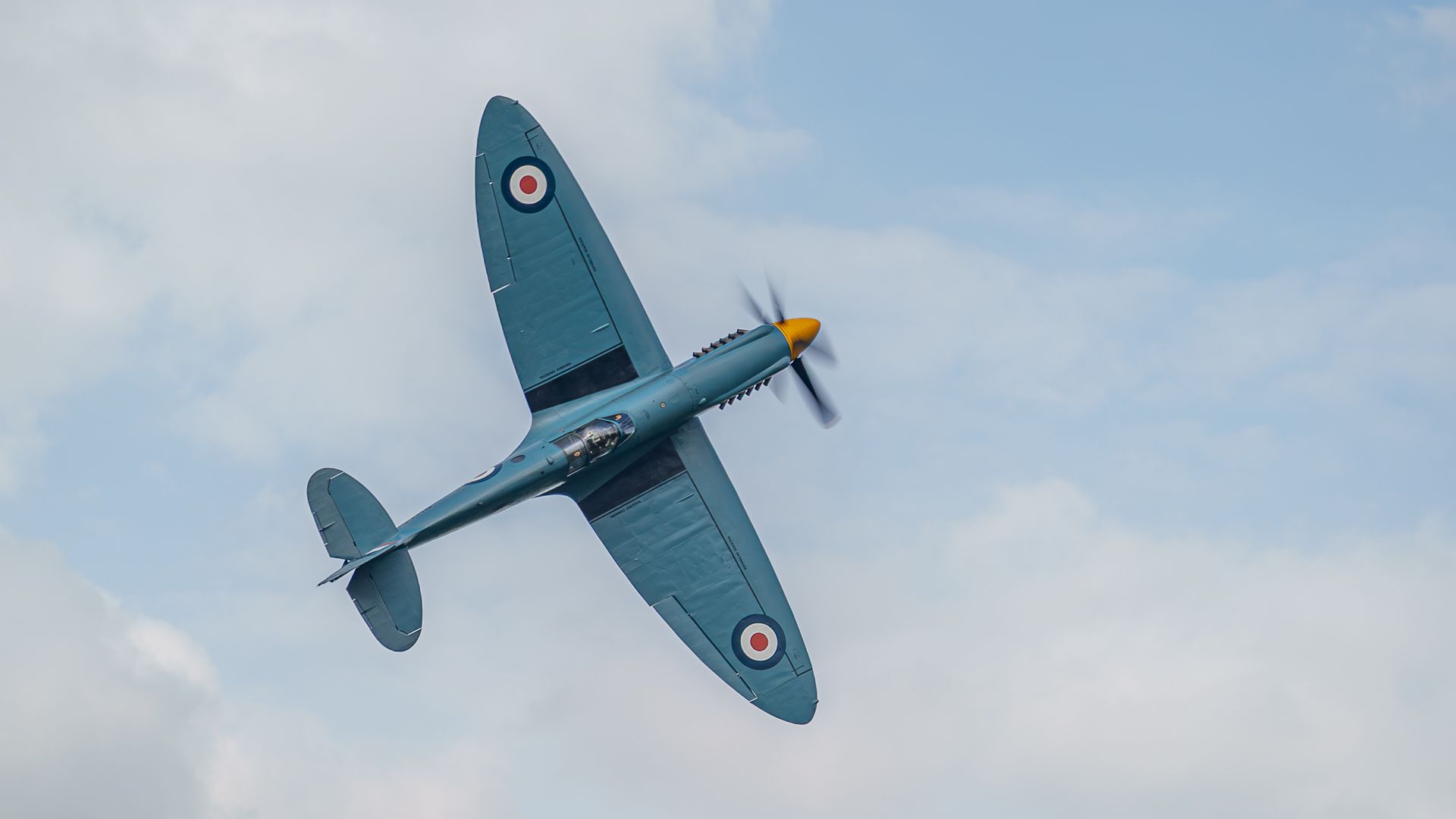 A view of a Spitfire aircraft in a flying display