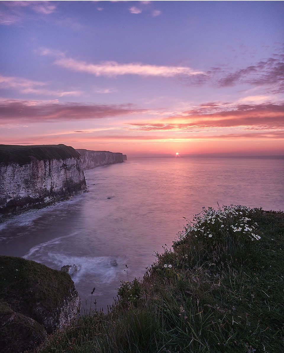 a sunset view of thornwick bay