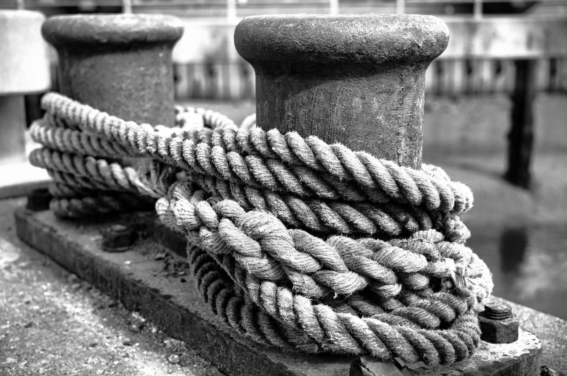 Mooring ropes around a harbour side bollard