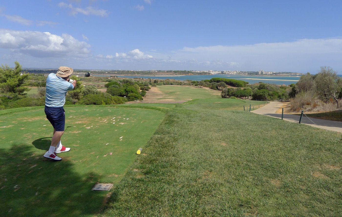 A golfer teeing off a shot