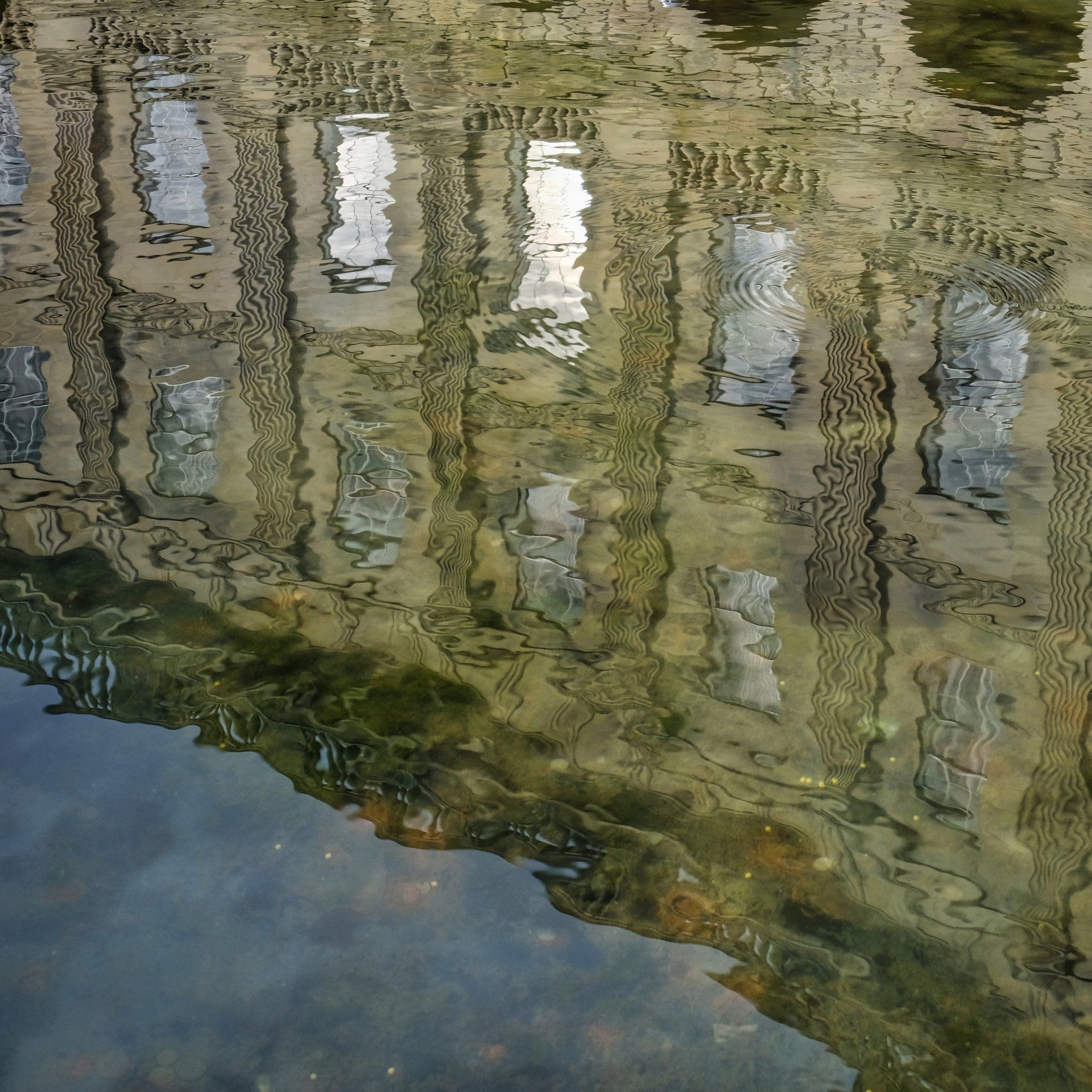 The Crescent, Buxton by Derek Smith the crescent buxton reflected in the water of the fountain