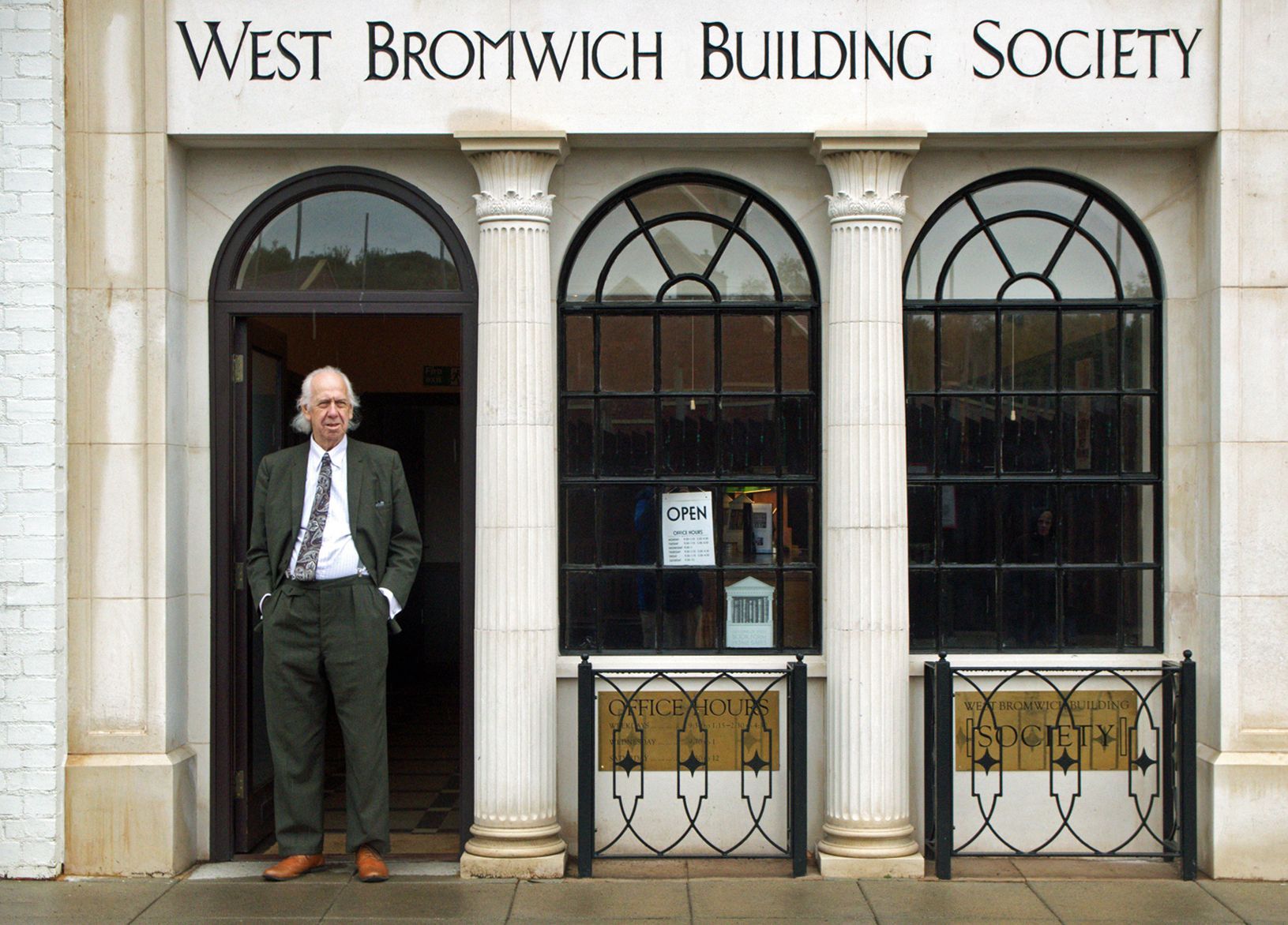 the building society branch manager standing in the doorway