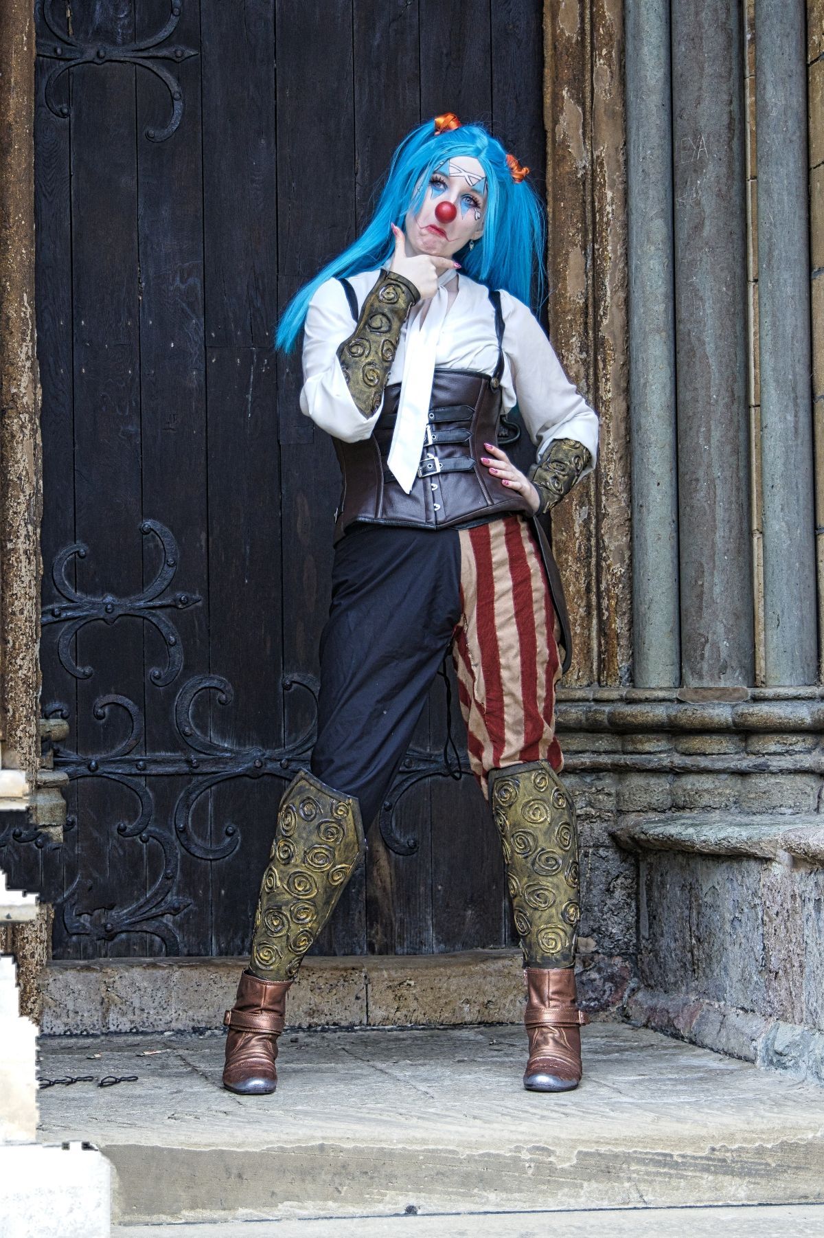 A female dressed in a cosplay outfit posed