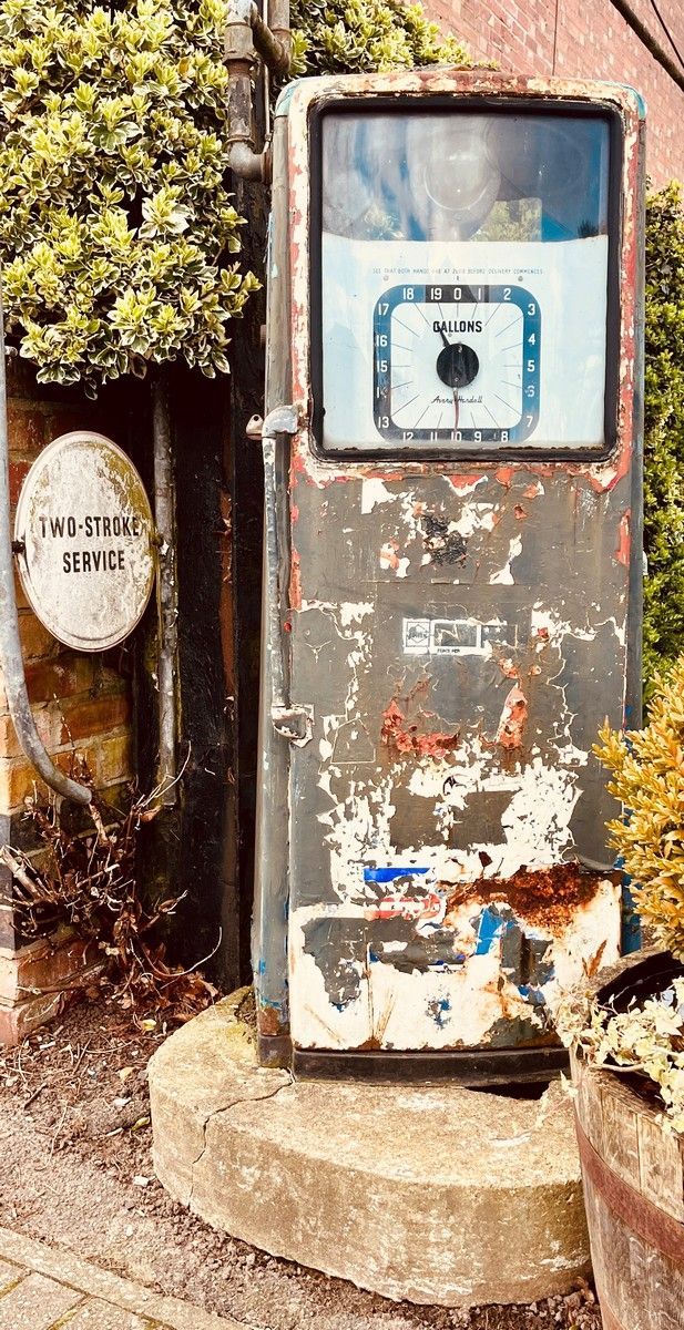 a weathered disused petrol pump