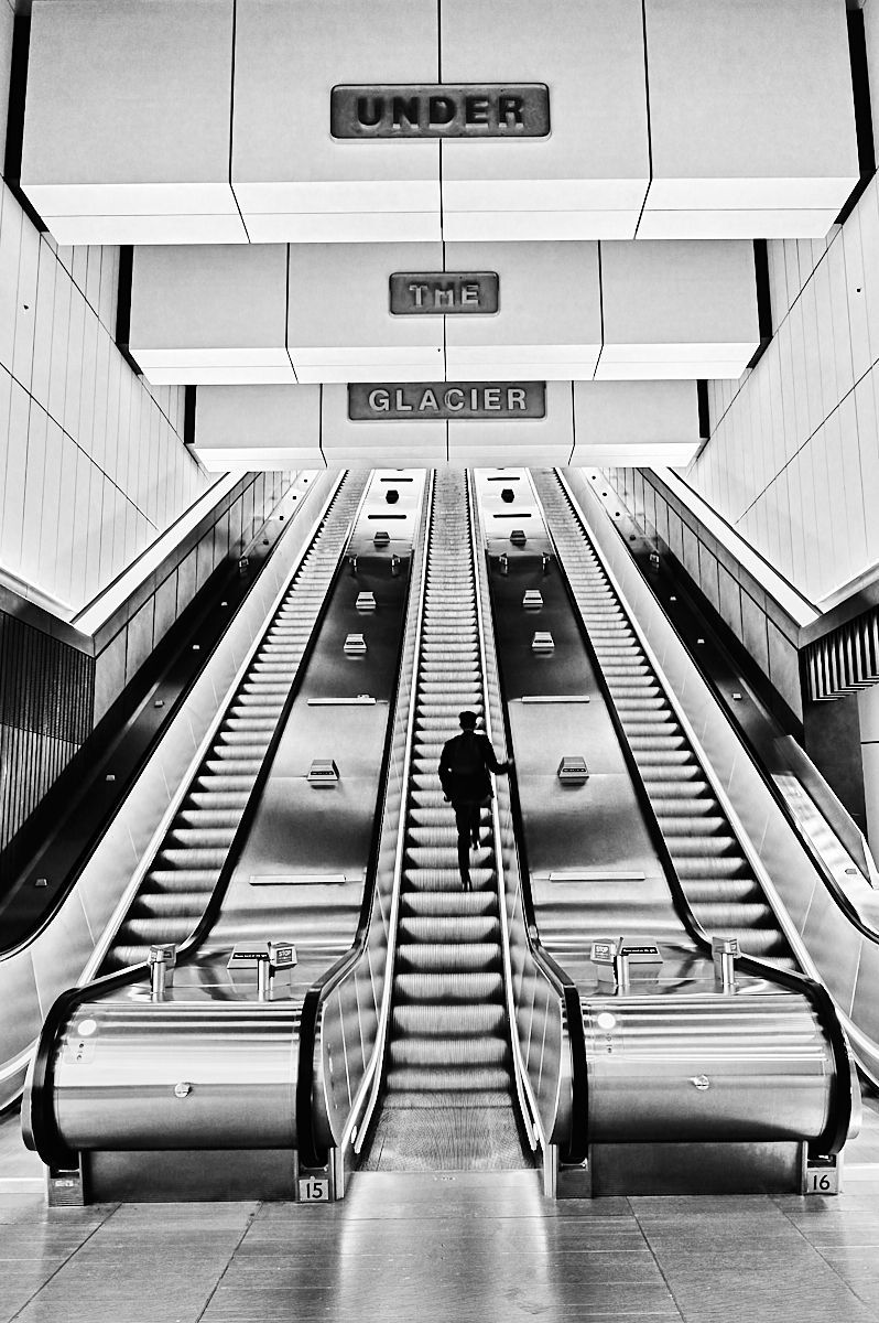 an escalator at an underground station
