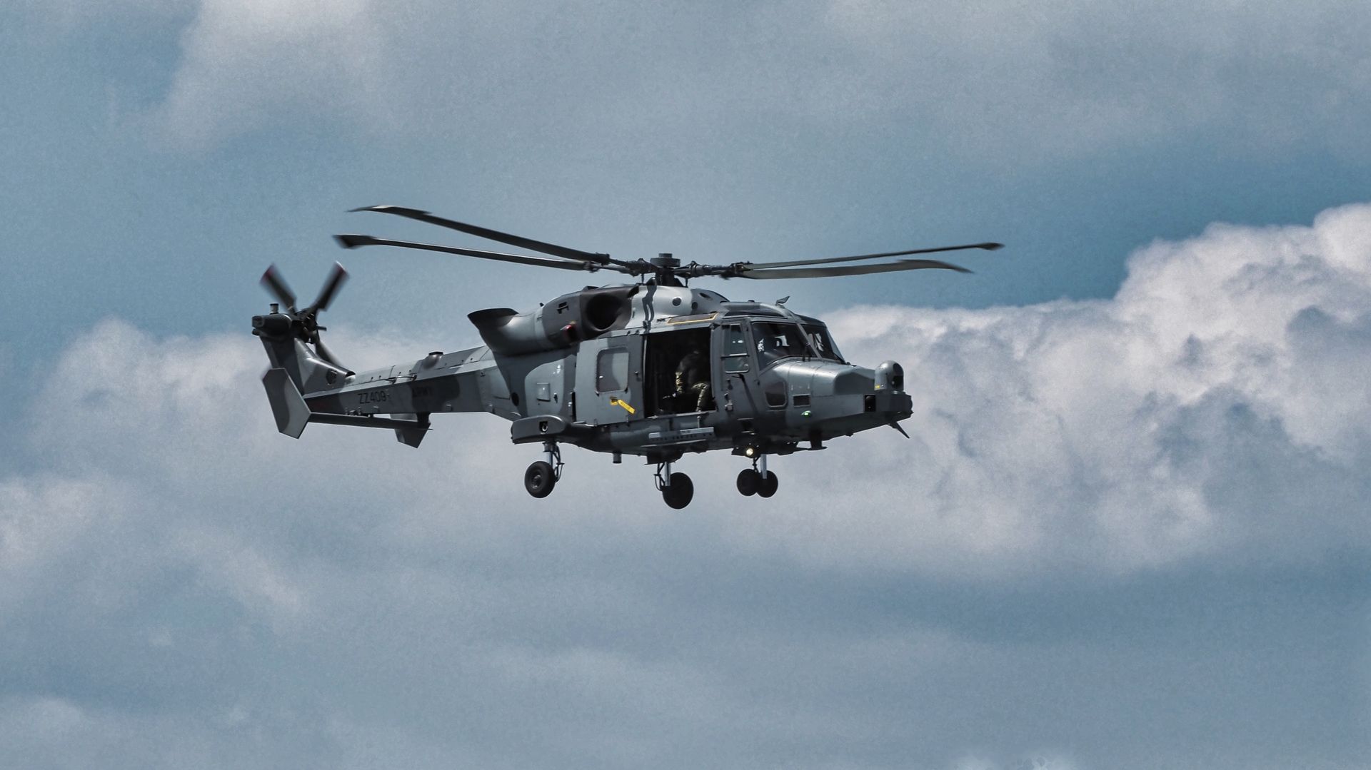 a Westland helicopter in flight over the Isle of Wight