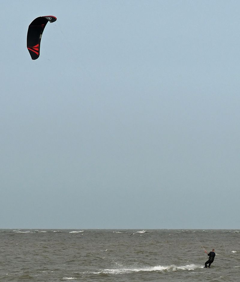 Windsurfer by Graham Harrison A wind surfer on the sea