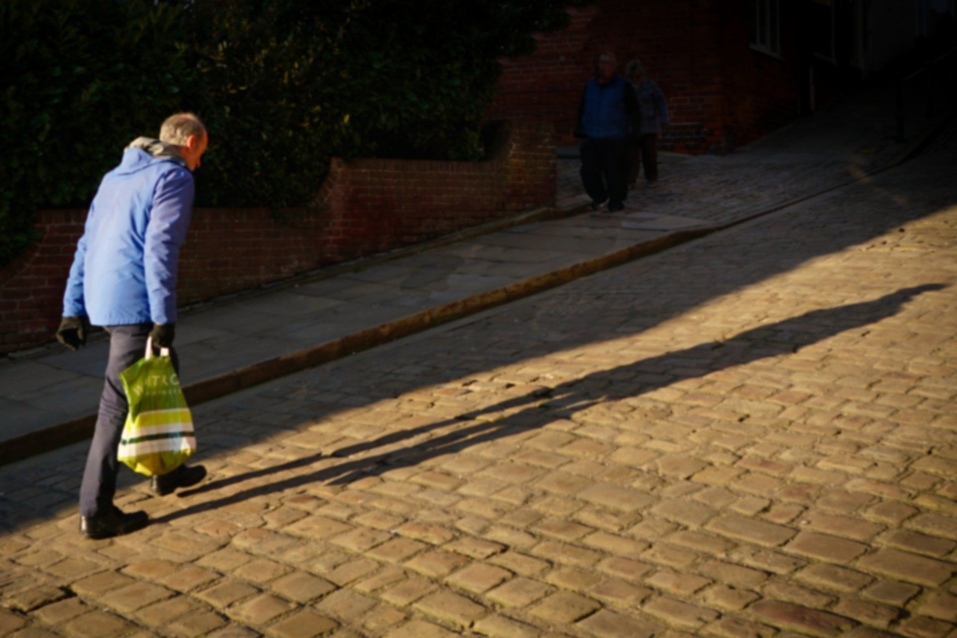 Photo: Derek Smith man walking up a hill