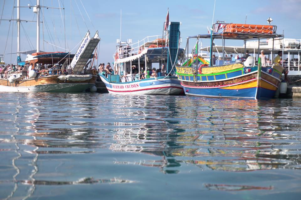 boat reflections in a harbour