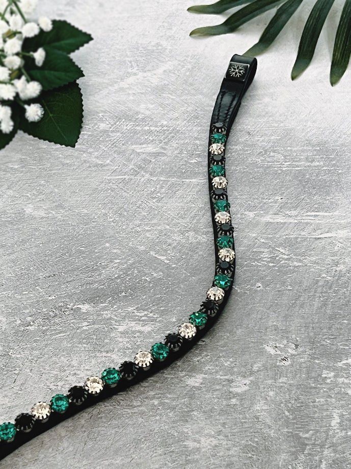 Let every hoofbeat echo with brilliance. Bermuda premium European leather Preciosa crystal browband. 8mm Preciosa crystals in Indicolite, Jet and Crystal. Traditional loops. Elegant anatomical curved fit. All sizes. By Ice Equestrian.
