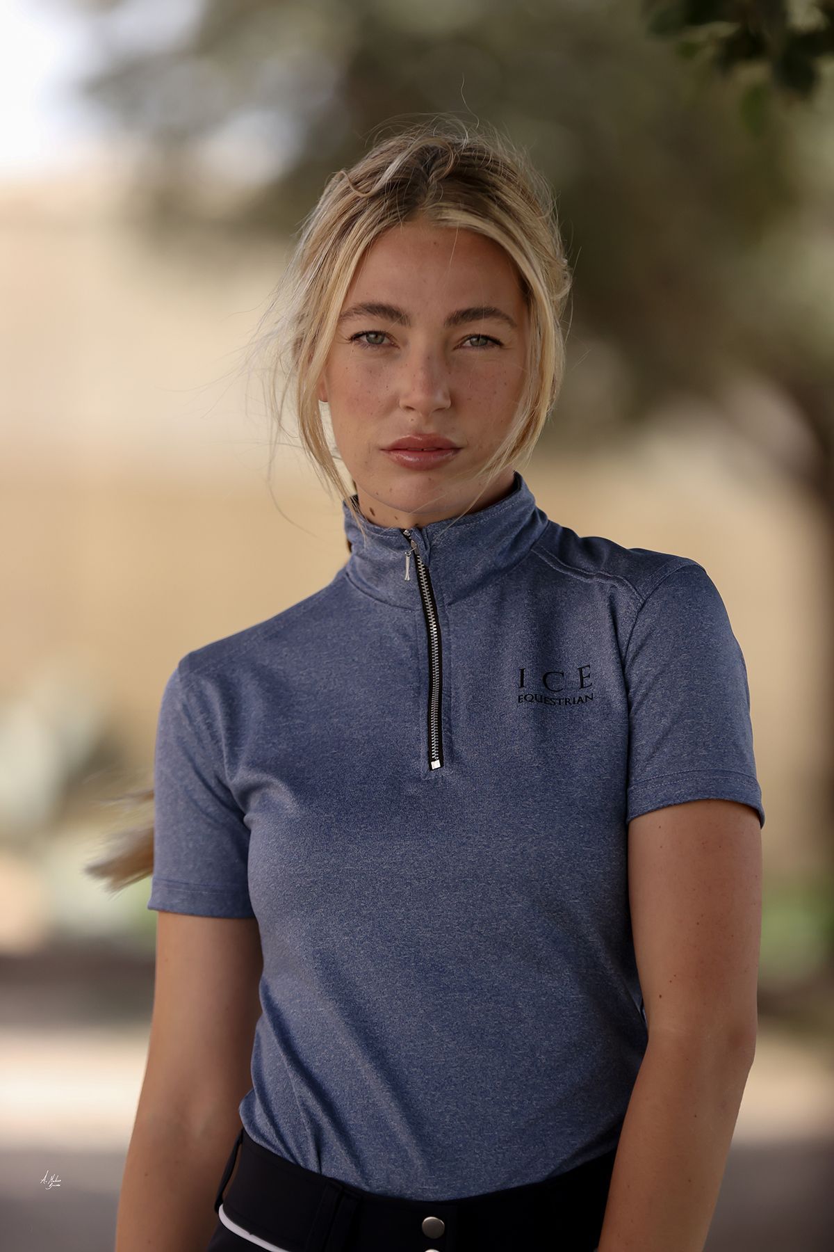 Discounted Denim Blue Jaylin equestrian short sleeve top. Lightweight Dry Fit fabric with 4-way stretch and denim-marl finish. By Ice Equestrian