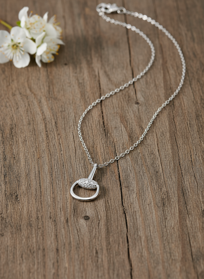 Regal Heritage Radiance half-snaffle bit pendant with adjustable chain. Handcrafted sterling silver with rhodium plating and zircon. By Ice Equestrian