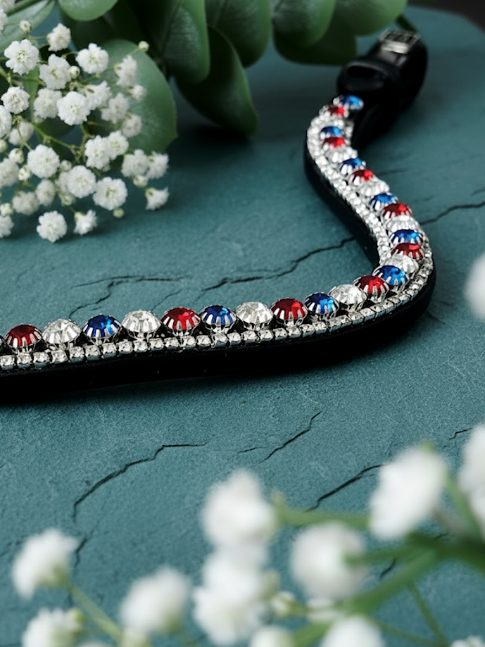 Let every hoofbeat echo with brilliance. The Valiant premium European leather Preciosa crystal browband. Triple-row design with 8mm Preciosa crystals in Red Velvet, Sapphire and Crystal. Adjustable quick-change with anti-slip grip. Anatomical deep U-shape fit. All sizes. By Ice Equestrian.