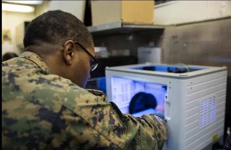 soldier using a 3d printer