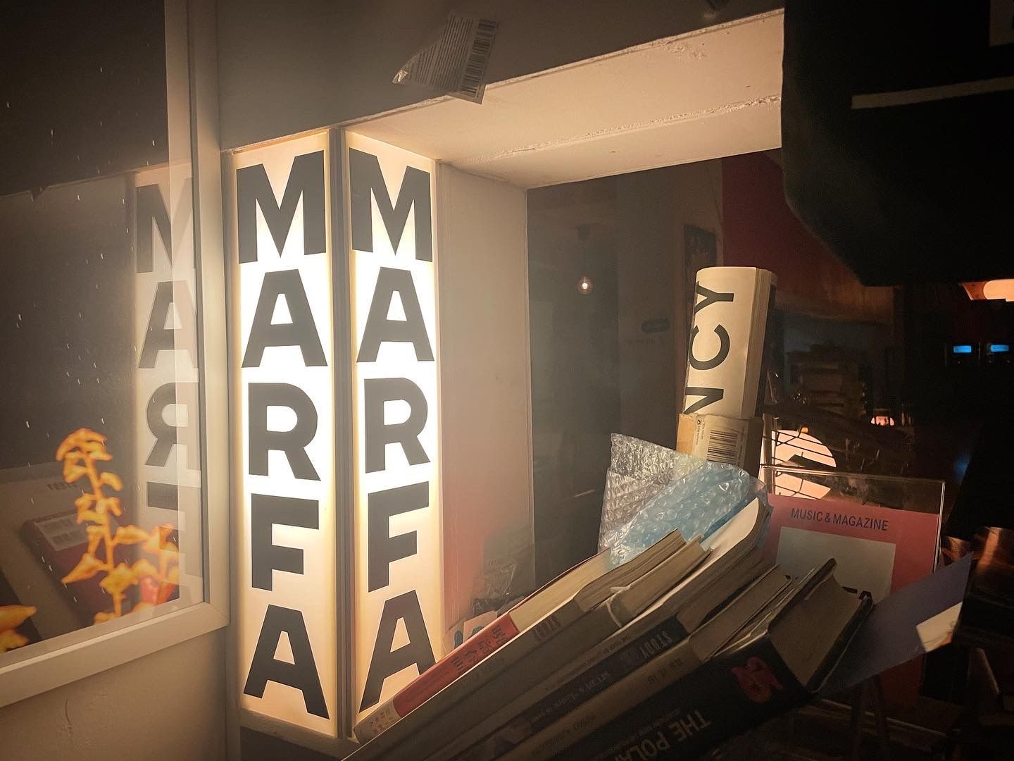 Custom designed vinyl letters on lightbox for Marfa bookstore located in Sapporo, JP.