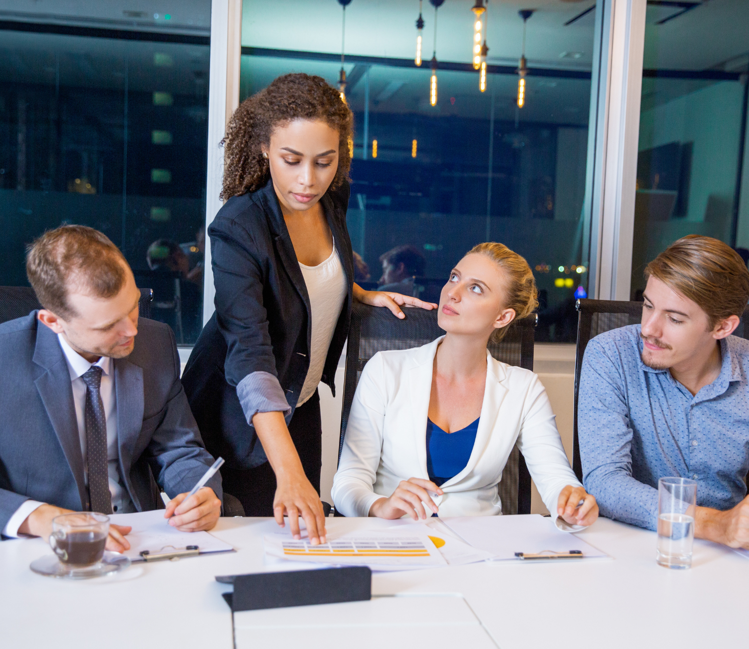 Professional consultant advising a client in a spacious, well-lit office