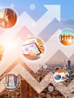 Market research team analyzing data and insights on computer screens for strategic decision-making.