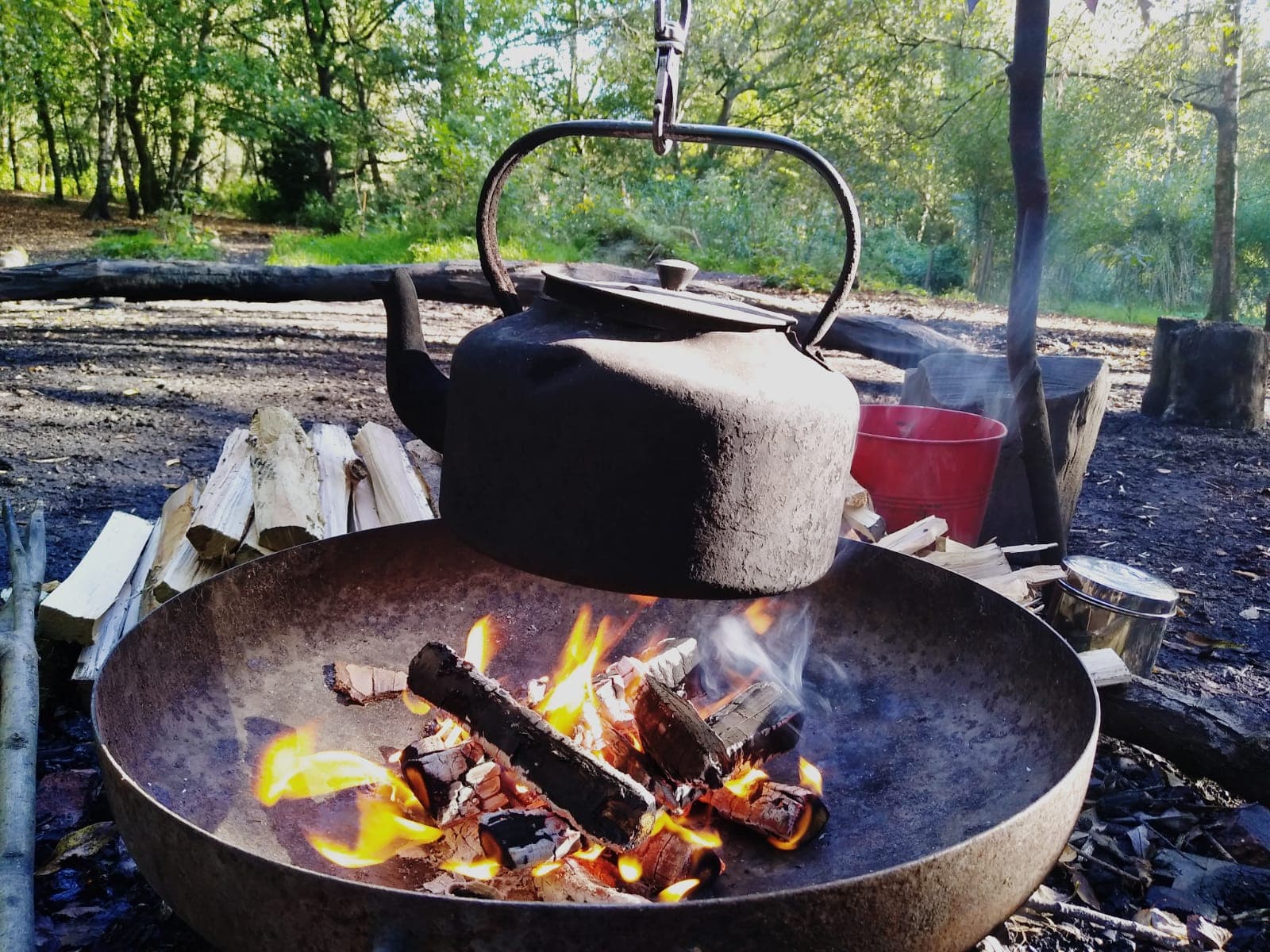 water boiling in a kettle over the fire pit in Summerseat