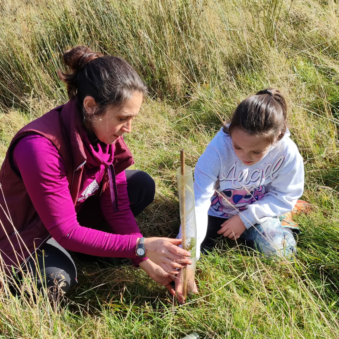 Leanne from Communitree tree planting with child