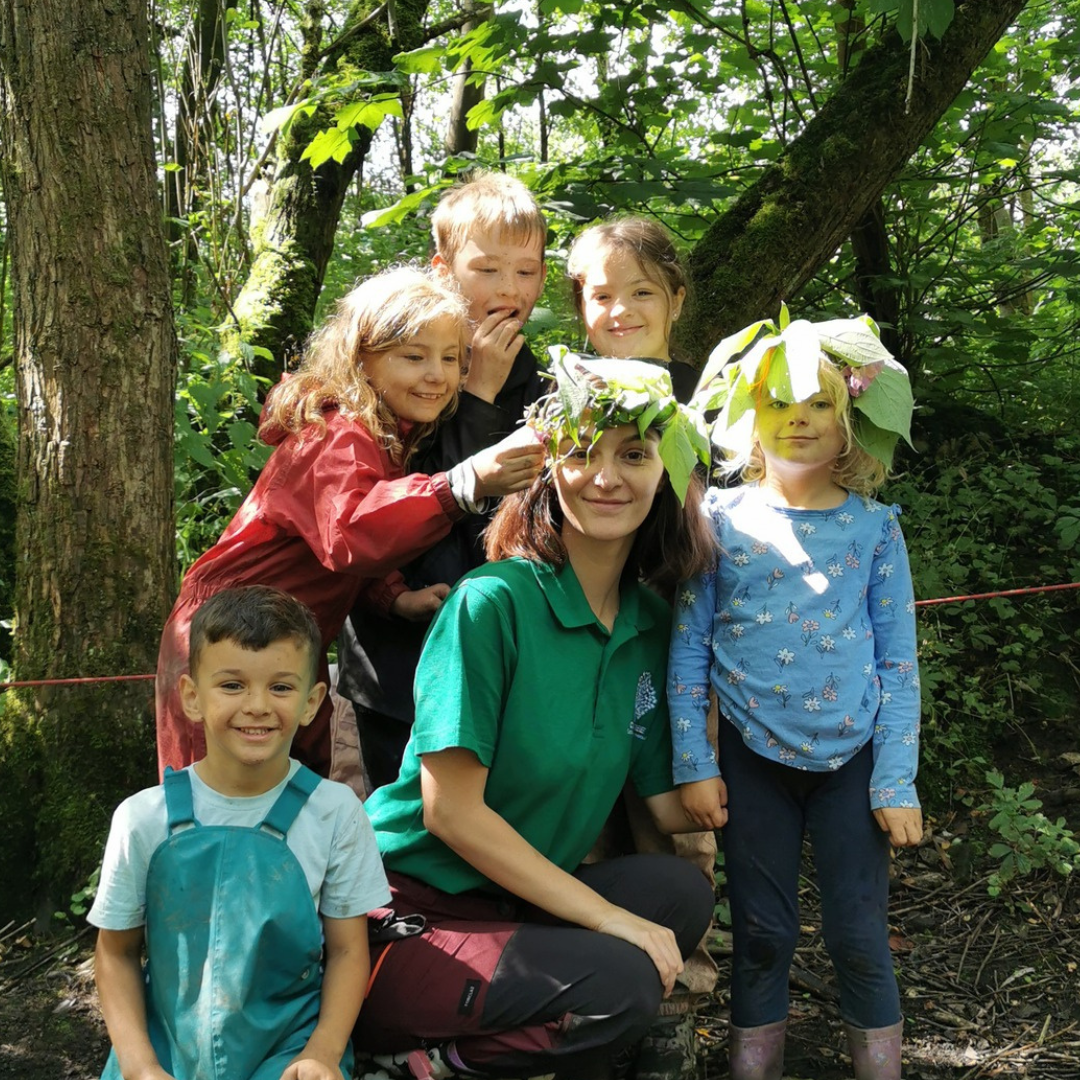 Natalie from Communitree with group of children with flower crowns