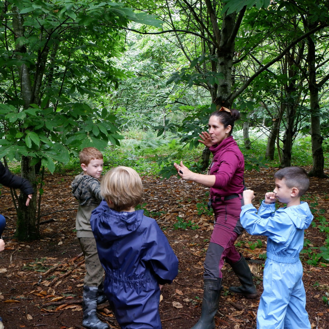 Forest School Leader playing games at Dunham Massey Communitree holiday club