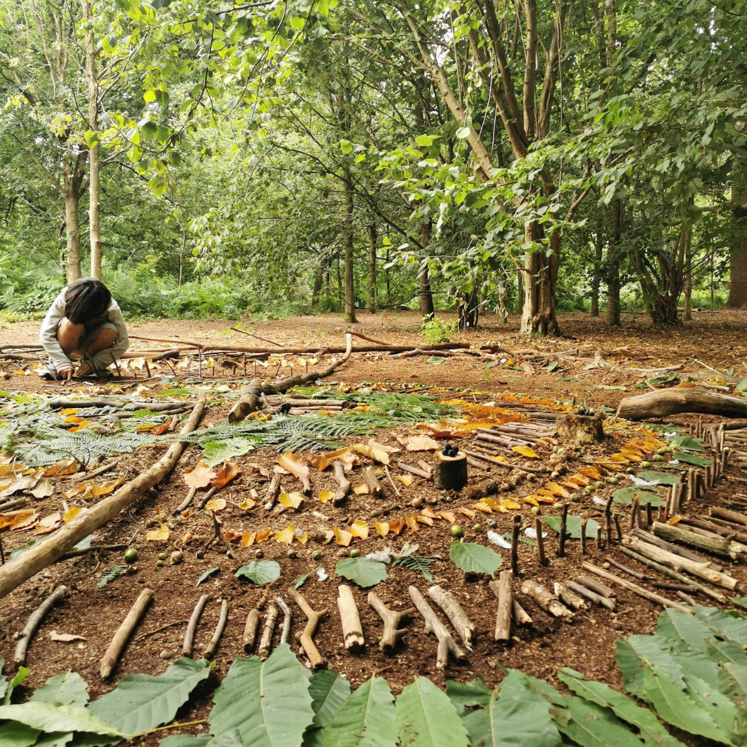 Woodland nature mandala made with leaves and twigs