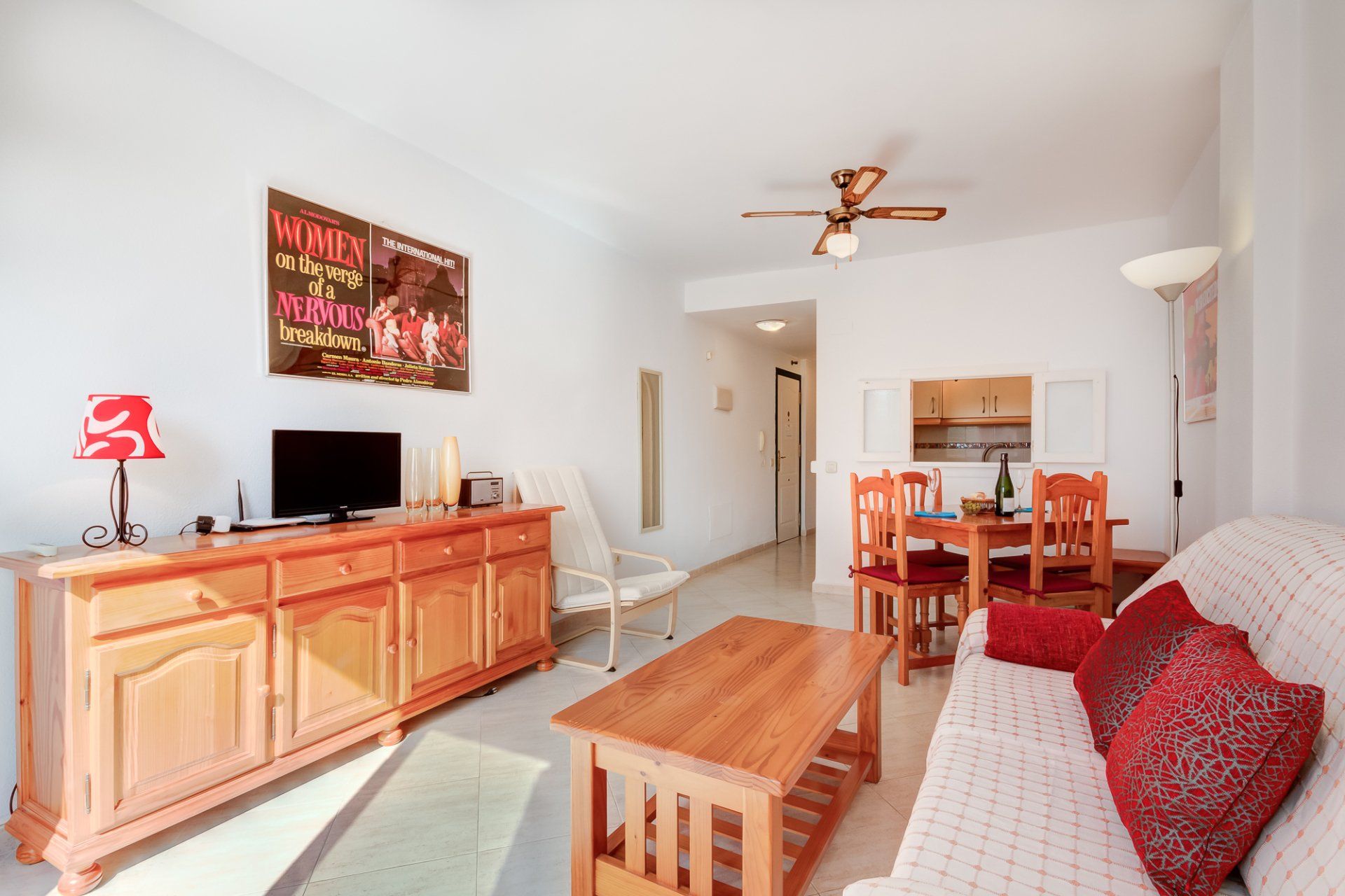 living room with dining area and serving hatch to kitchen
