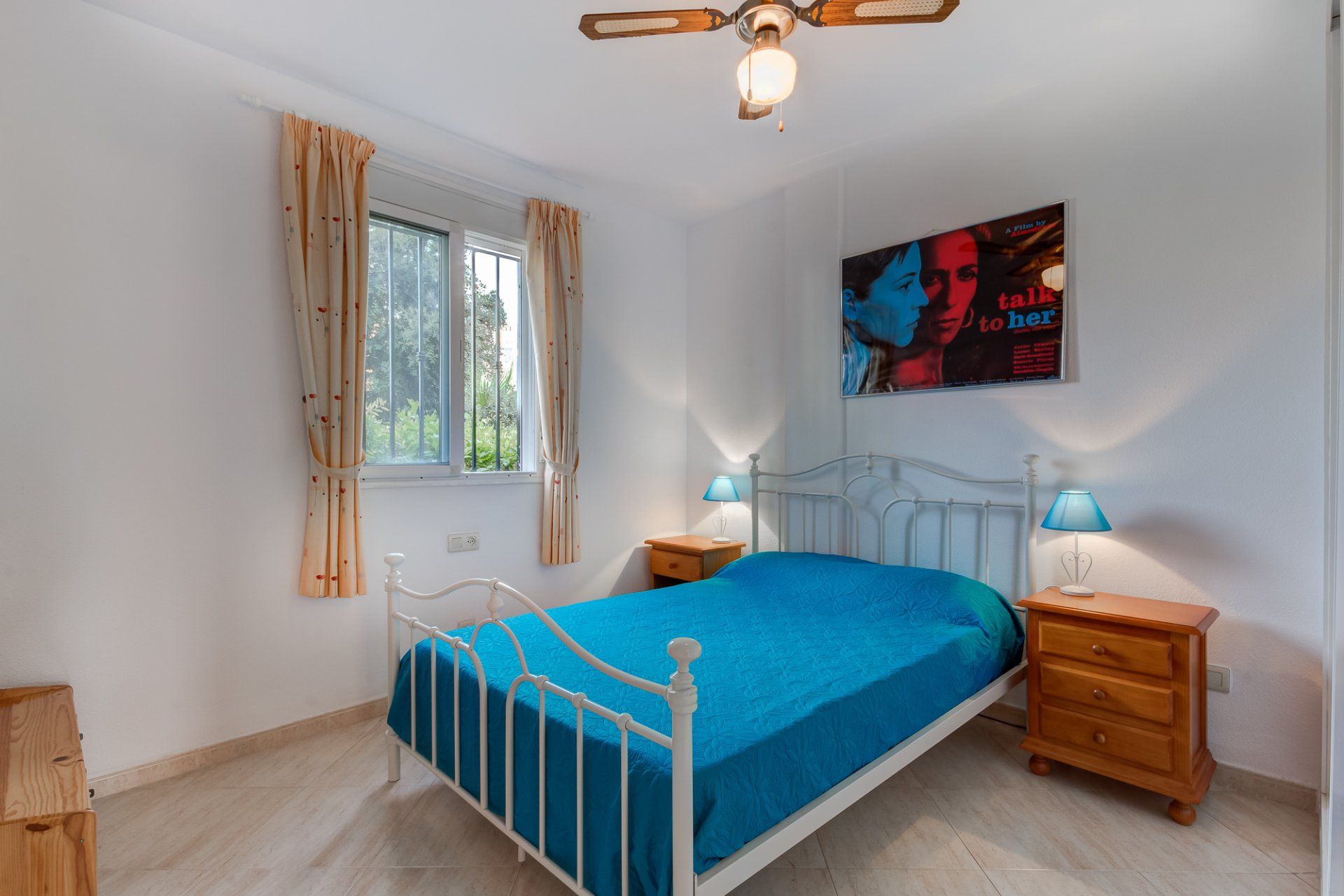 bedroom with double bedstead and blue bedding
