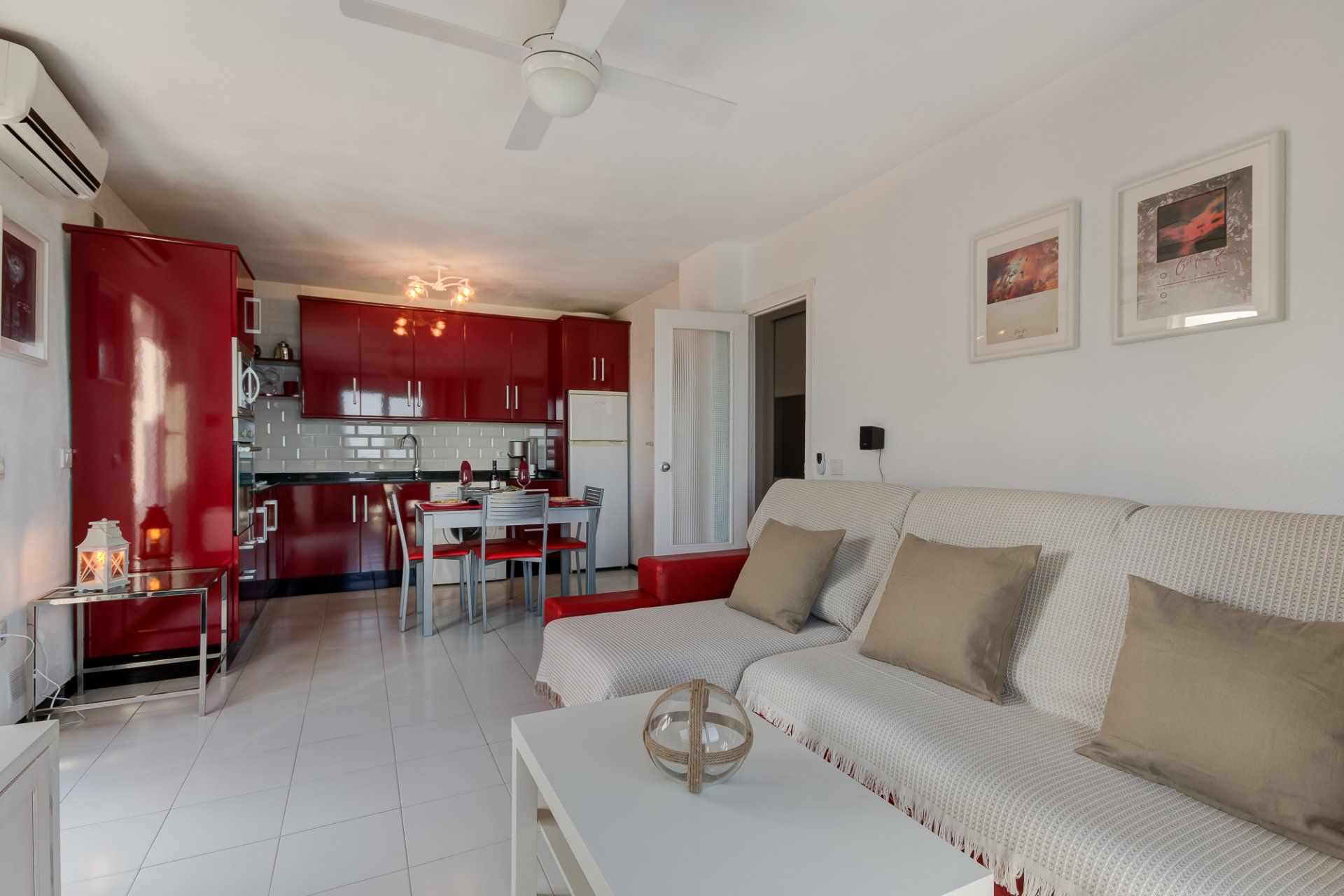 living and dining and kitchen area with red high gloss kitchen units