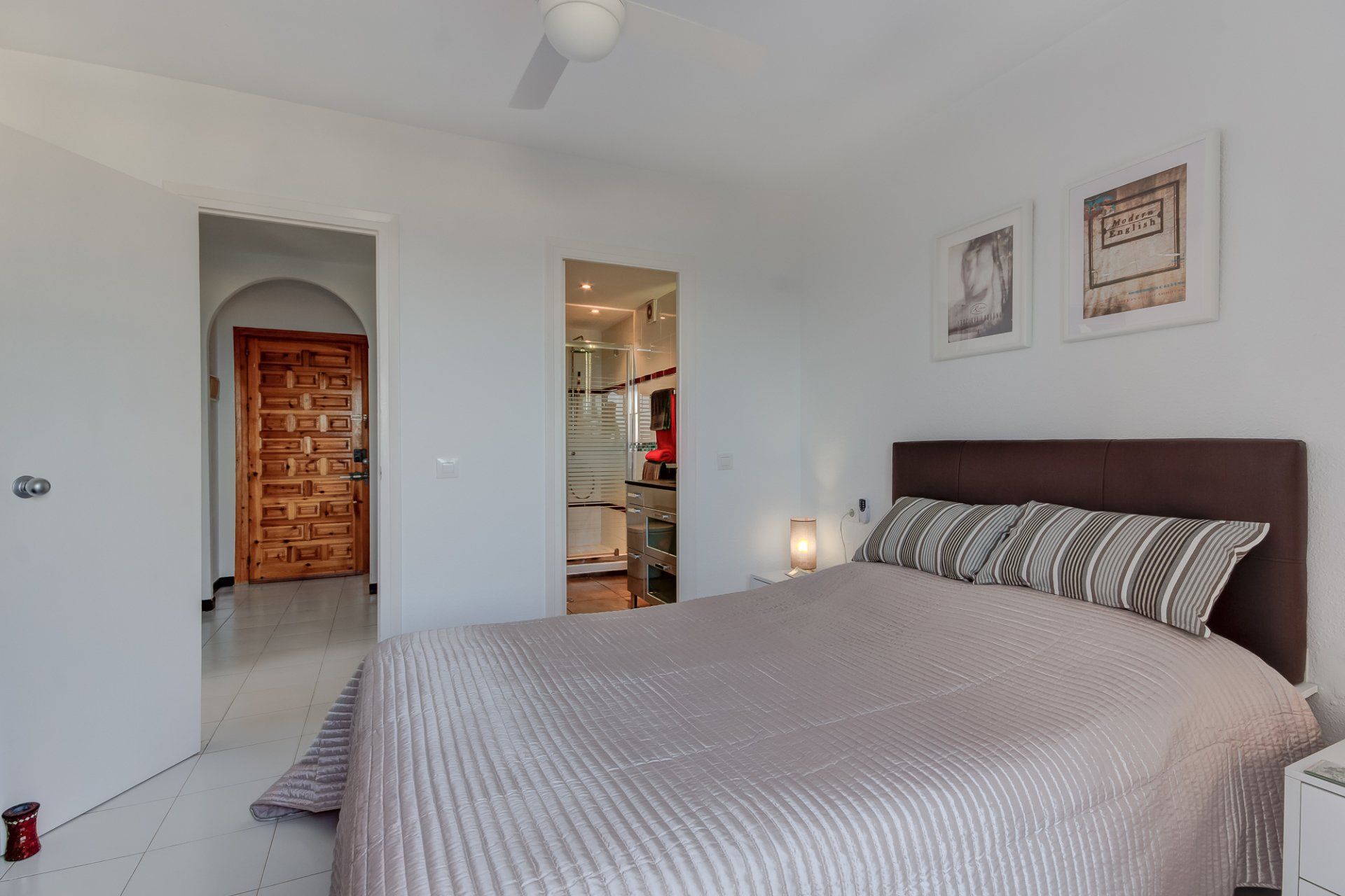 with your back to the patio doors looking into the bedroom and into the ensuite on the right and the door to the hallway to the left