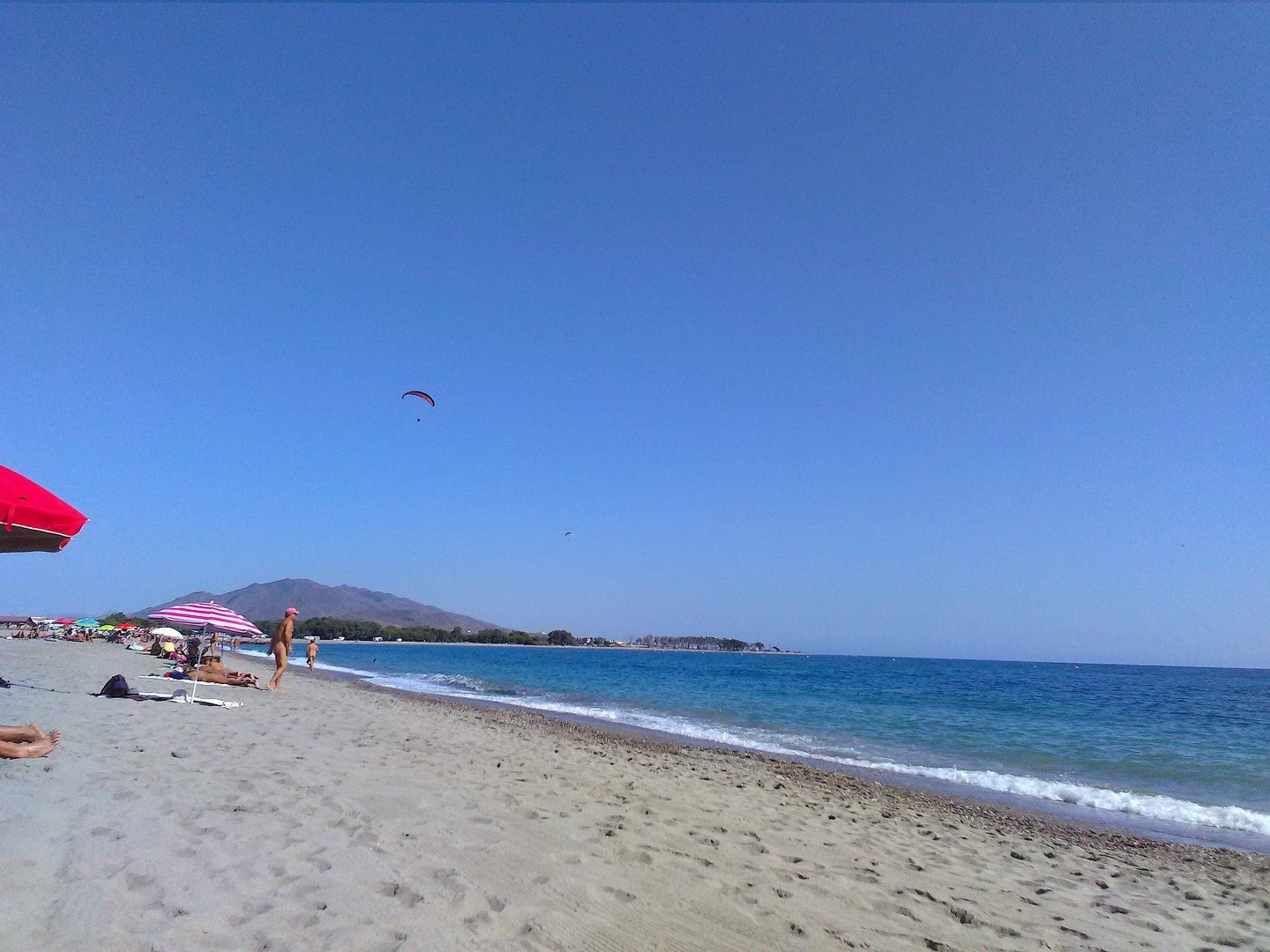 close up of surf lapping on sandy shoreline