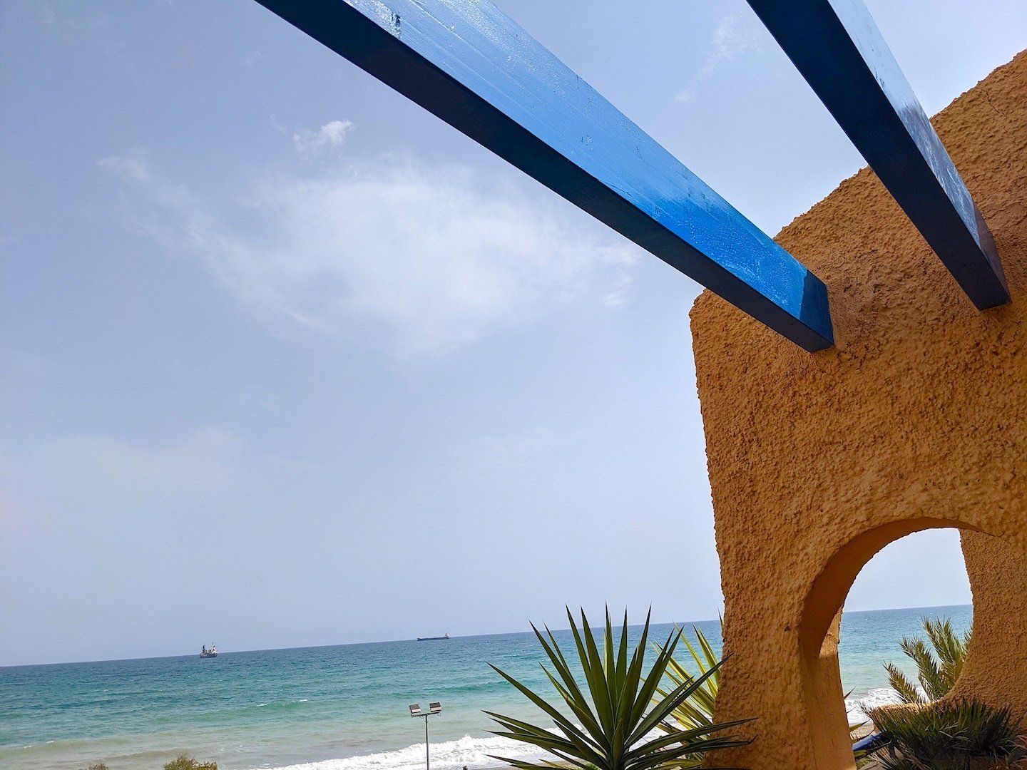beams in place up above with a view of the sea in the background