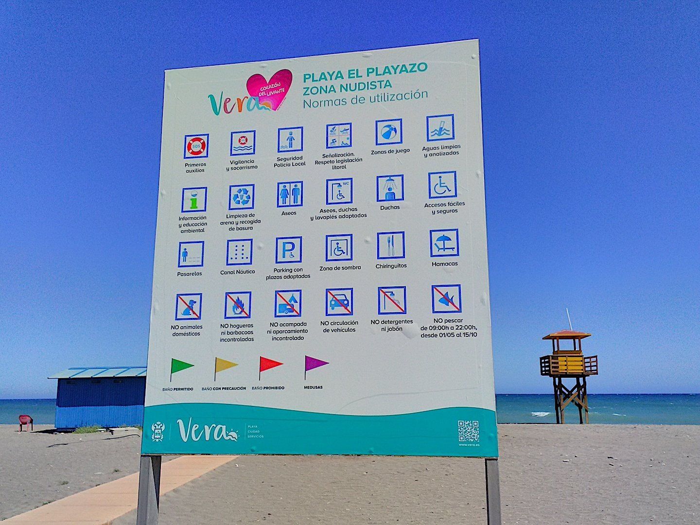 close up of zona naturista sign which lists symbols telling people the norms of the beach