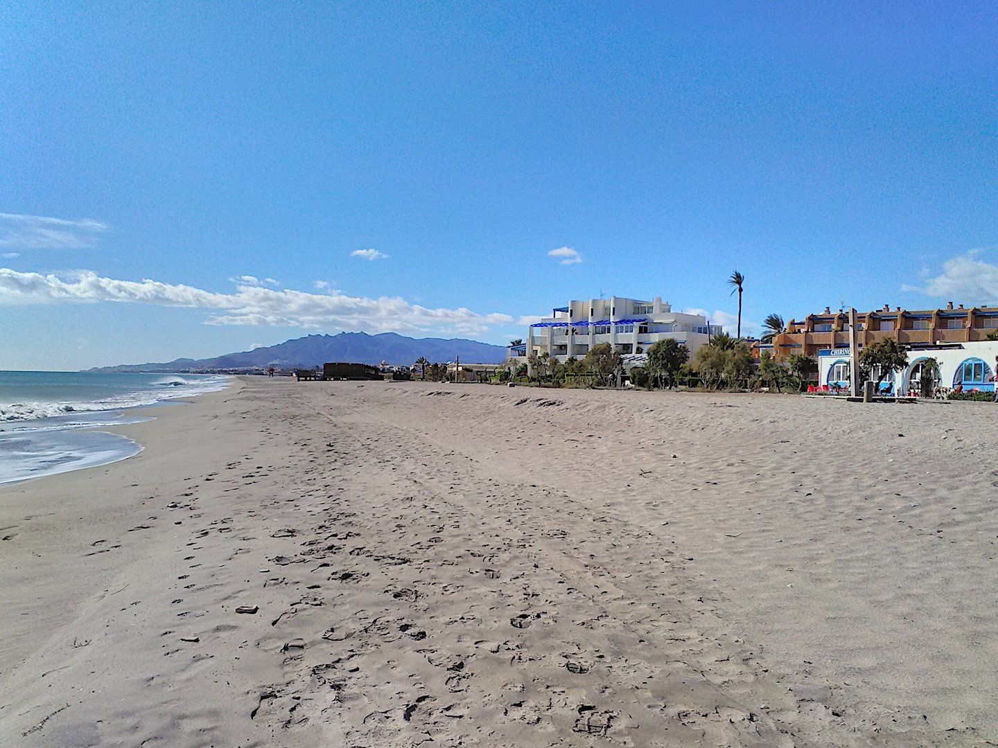 picture demonstrates how long and sandy the naturist beach is