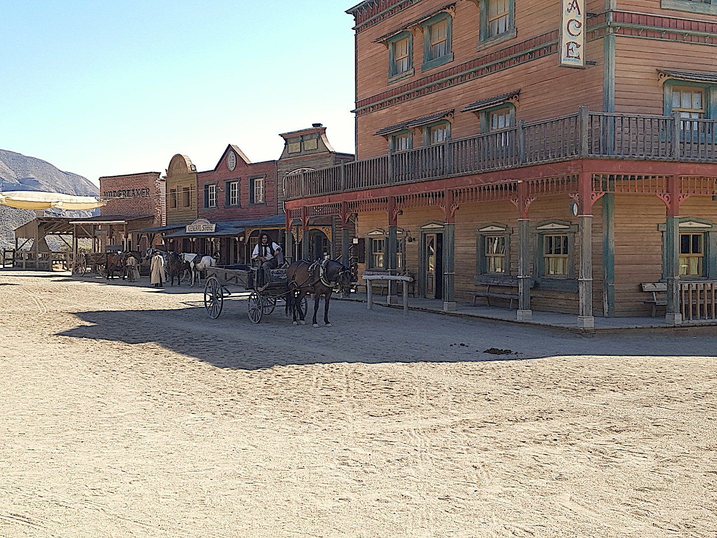 photo_of_street_scene_from_western_movie_set_horse_outside_saloon