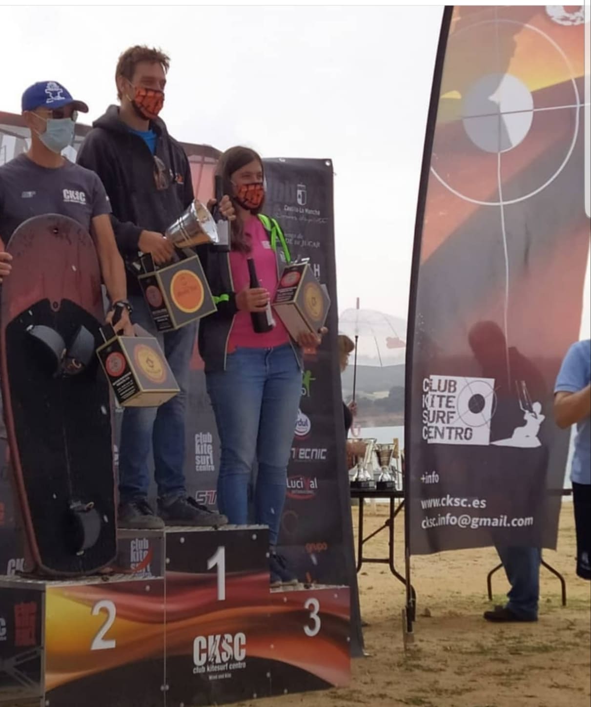 people standing on a podium receiving their awards