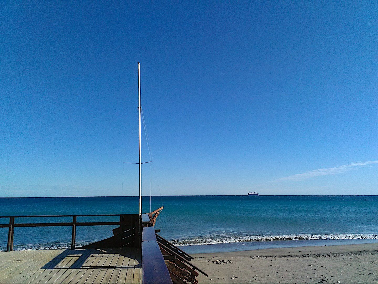 it looks like you are on the deck of a pirate ship looking out to sea but it is actually the deck of the pirate bar on the beach