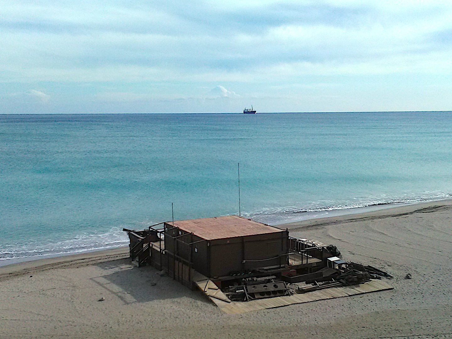 view of pirate bar from above right on the edge of the sand by the waters edge