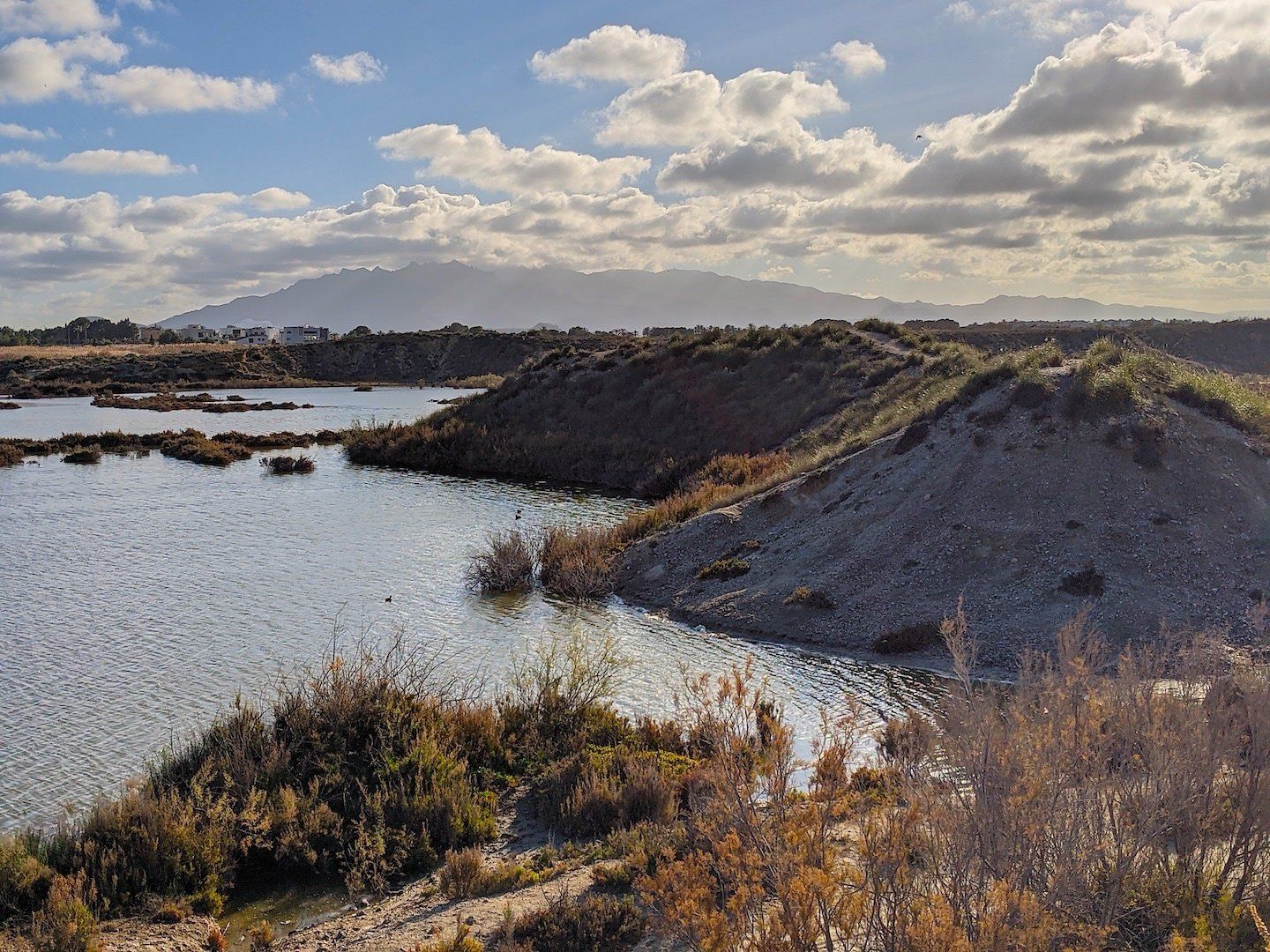 salt water marshes with mini mountain looking sections in the water