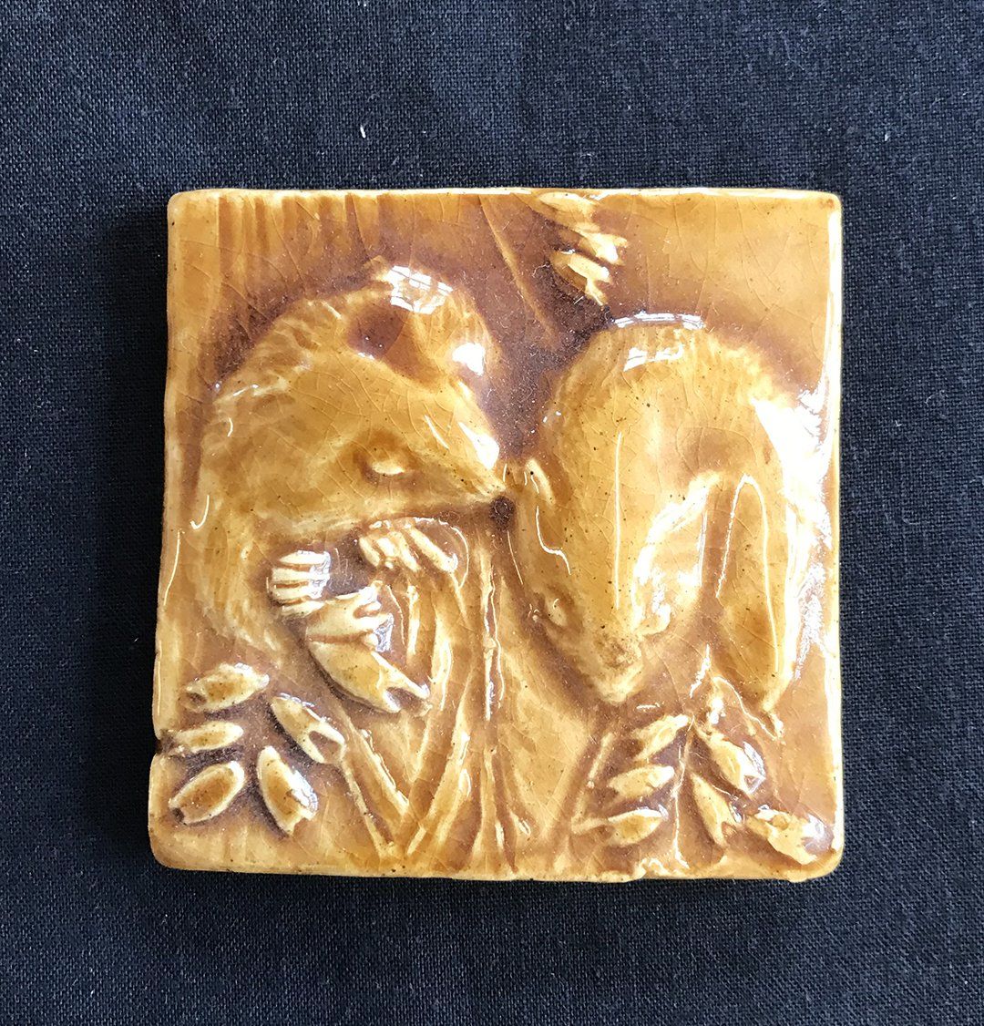 Hand made feature tile titled